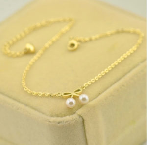 Lắc chân nữ titan hình chiếc nơ ngọc trai mạ vàng tươi 24k cực xinh