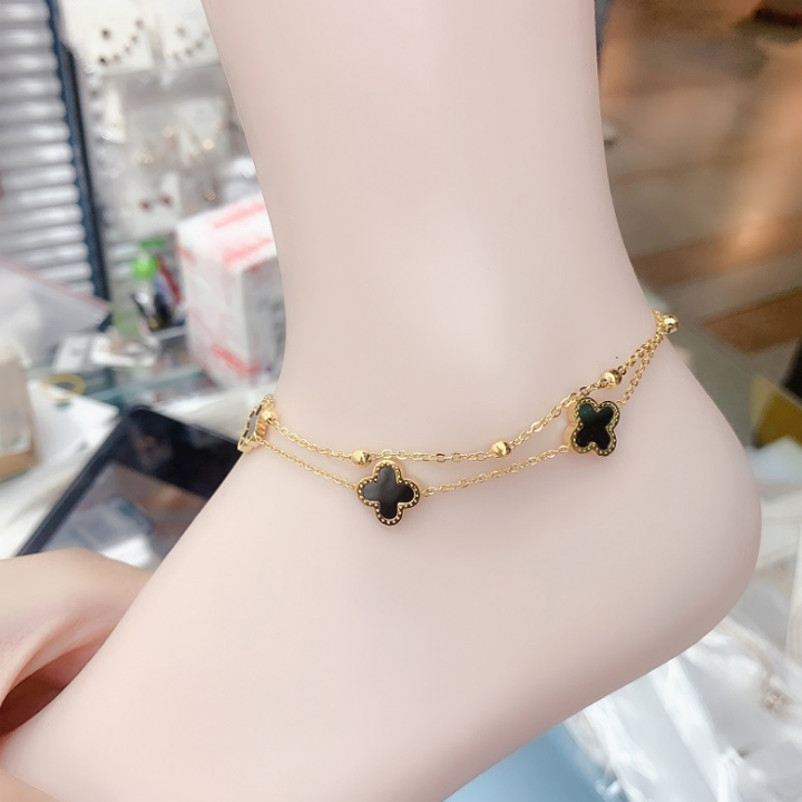Lắc chân nữ titan 2 tầng hoa 4 cánh LV màu vàng 24k