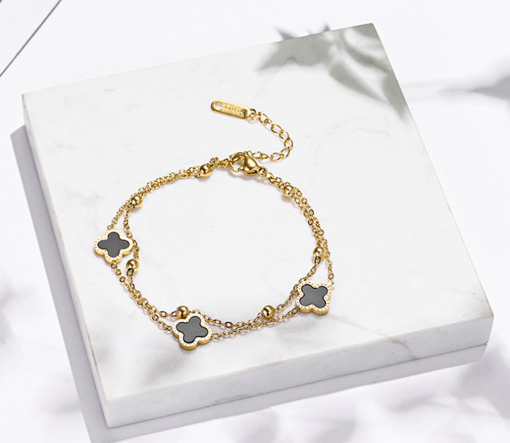 Lắc chân nữ titan 2 tầng hoa 4 cánh LV màu vàng 24k