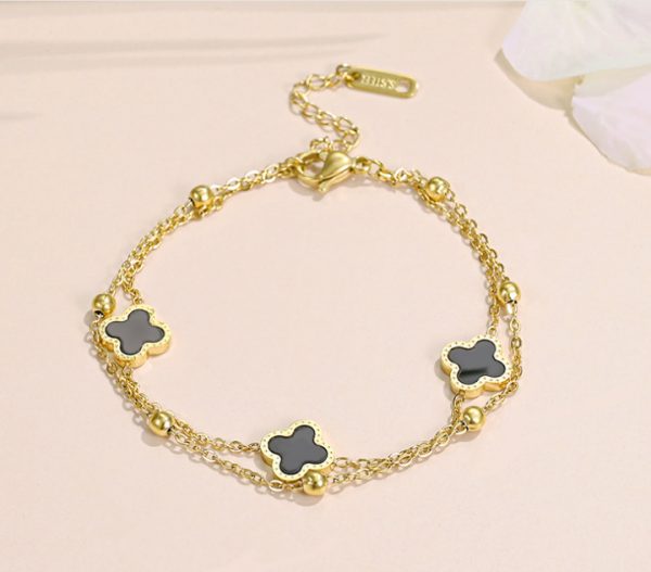 Lắc chân nữ titan 2 tầng hoa 4 cánh LV màu vàng 24k