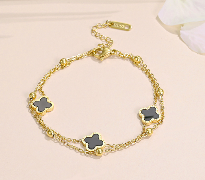 Lắc chân nữ titan 2 tầng hoa 4 cánh LV màu vàng 24k