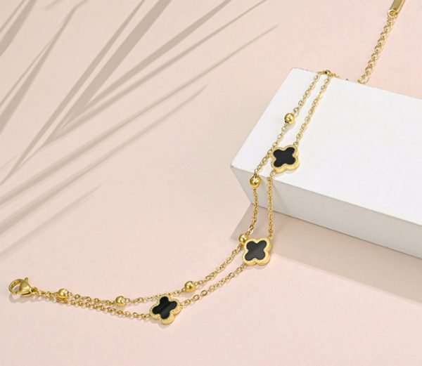 Lắc chân nữ titan 2 tầng hoa 4 cánh LV màu vàng 24k