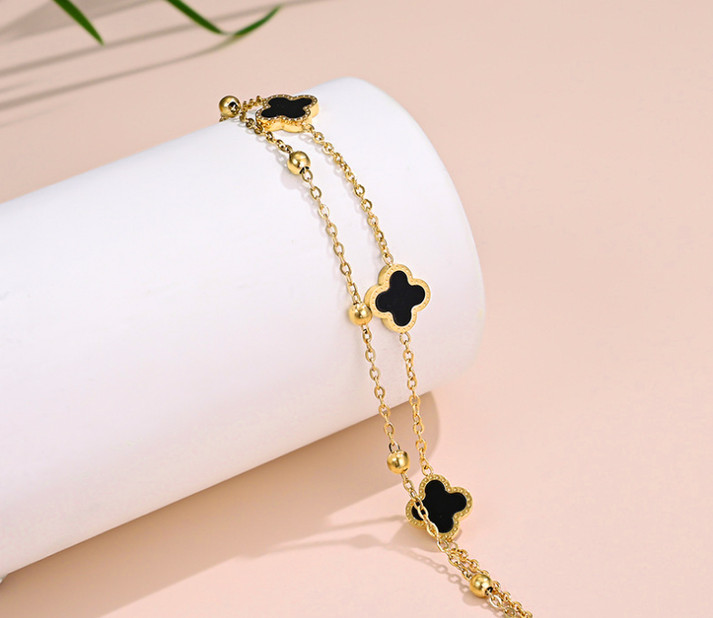 Lắc chân nữ titan 2 tầng hoa 4 cánh LV màu vàng 24k