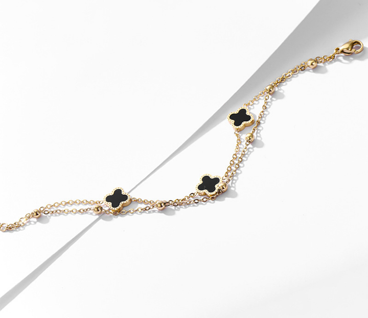 Lắc chân nữ titan 2 tầng hoa 4 cánh LV màu vàng 24k