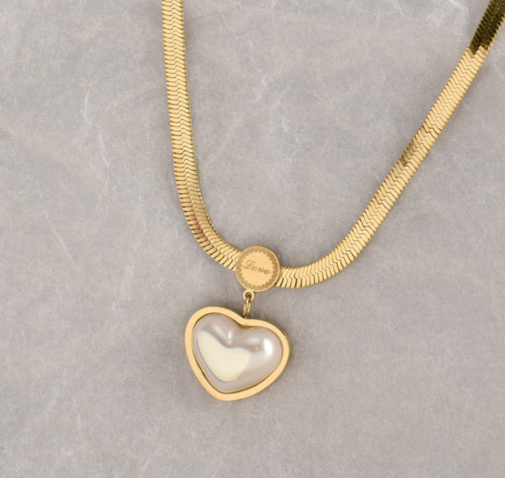 Dây chuyền titan trái tim đính ngọc trai