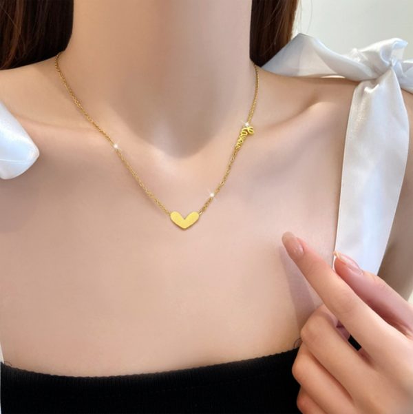 TN024a-Dây chuyền,vòng cổ titan trái tim cách điệu chữ love màu hồng