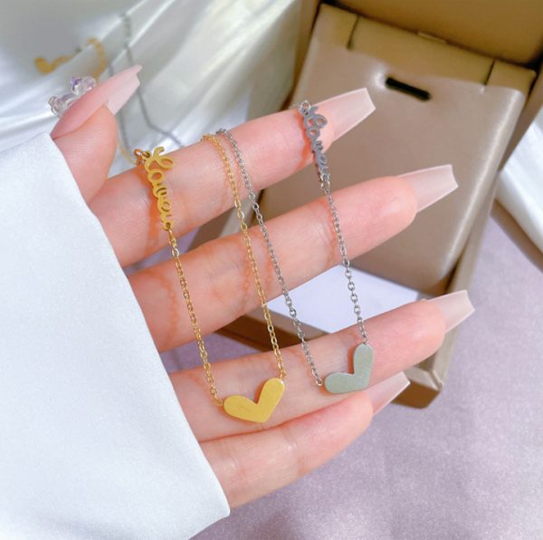 TN024d-Dây chuyền,vòng cổ titan trái tim cách điệu chữ love màu hồng