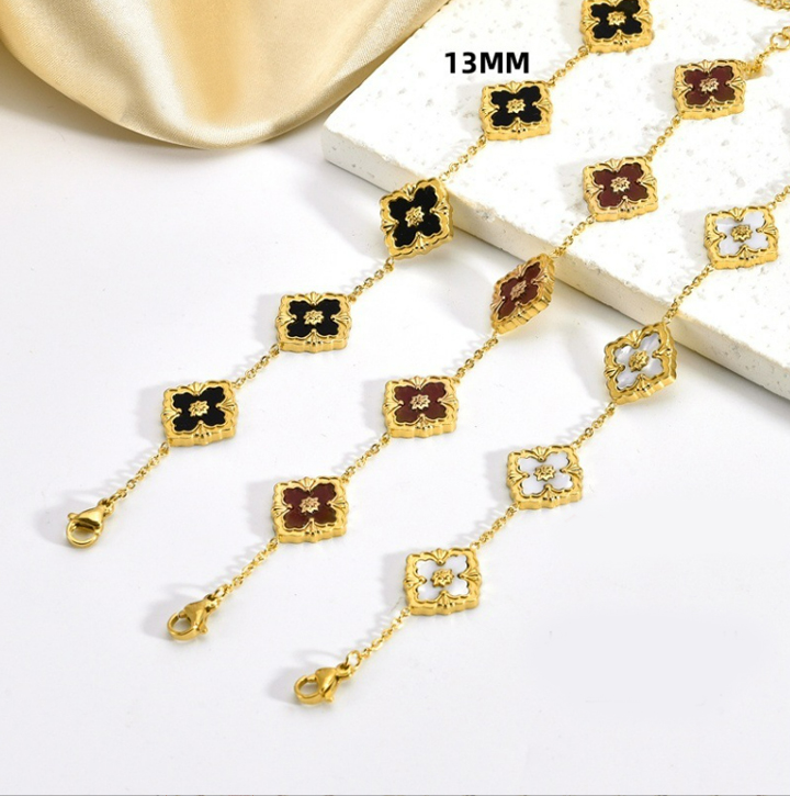 TA068a Lắc tay titan 5 bông hoa 4 cánh may mắn