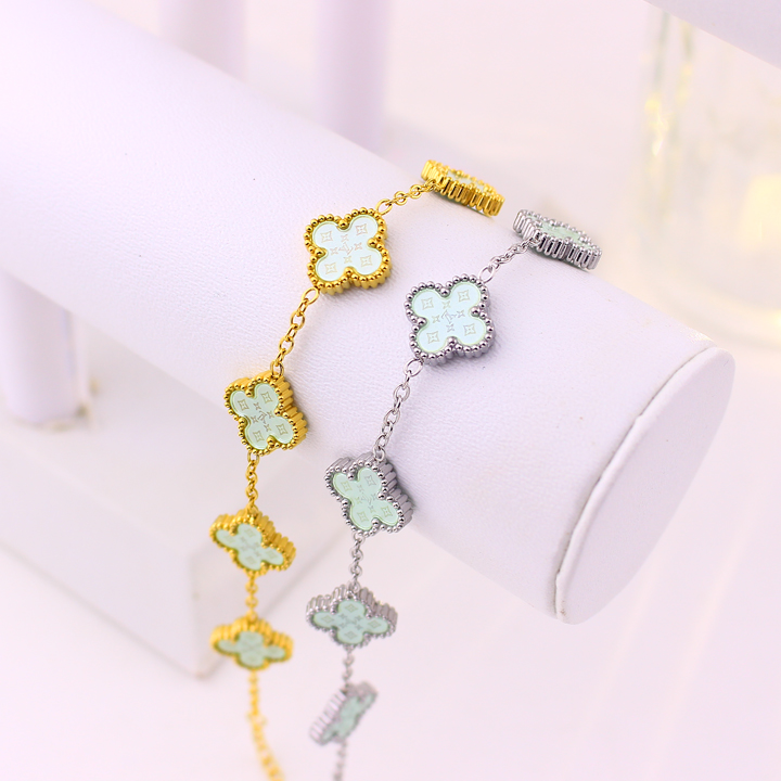 TA493b Lắc tay van cleef hoa 4 cánh nền màu xanh ngọc