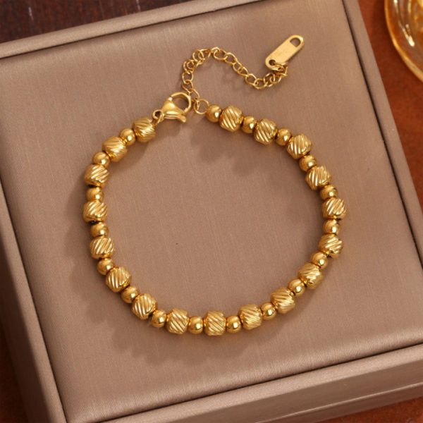 TA091e Lắc tay nữ bi titan chạm máy