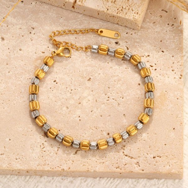 TA092c Lắc tay nữ bi titan chạm bánh răng