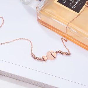 TA094d Lắc tay titan con cá phun cát màu vàng hồng