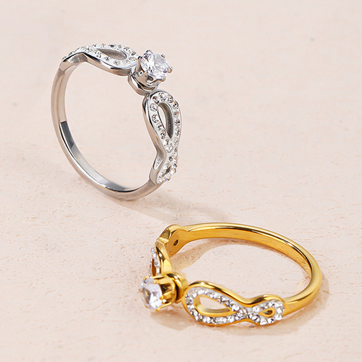 TC019b-Nhẫn nữ titan 1 hột cao cách điệu 2 bên dấu vô cực