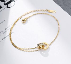 Lắc chân titan 2 khoen tròn số la mã màu vàng 24k