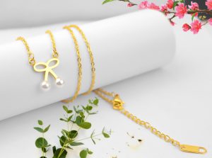 Dây chuyền titan hình chiếc nơ ngọc trai