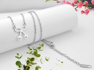 Dây chuyền titan hình chiếc nơ ngọc trai