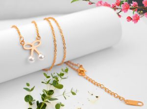 Dây chuyền titan hình chiếc nơ ngọc trai