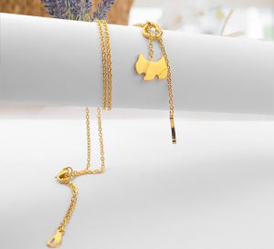 Dây chuyền titan con có, con cún cách điệu cục xương màu vàng