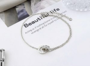 Lắc chân titan 2 khoen lồng số la mã màu trắng