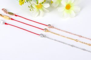 TA233B-Lắc tay titan chỉ đỏ may mắn