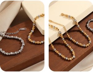 TA467j-Lắc tay nữ titan bi móc máy cách điệu