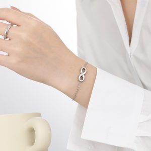 TA161g-Lắc tay nữ titan dấu vô cực màu trắng