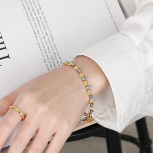 TA168f-Lắc tay nữ titan hình trái tim cách điệu hột đá