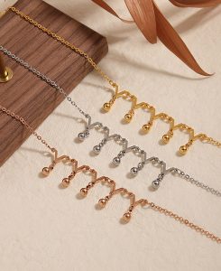 TA679d-Lắc chân nữ titan bi cách điệu