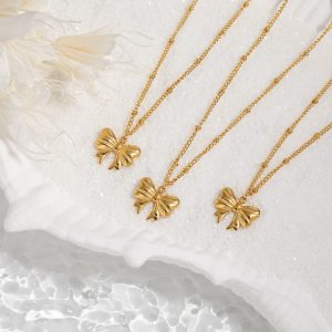 TN003g-Dây chuyền vòng cổ titan mặt hình cái nút thắt chiếc nơ
