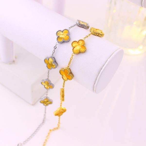 TA492d Lắc tay van cleef hoa 4 cánh nền màu hổ phách