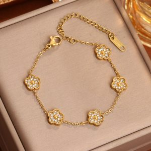 TA103c Lắc tay titan hoa van 5 cánh đính full kim