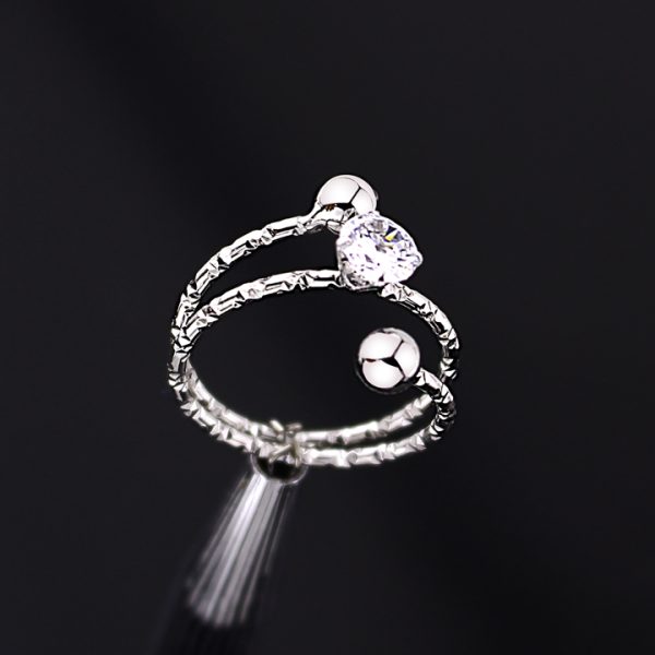 N004a Nhẫn nữ inox 2 đầu bi đính đá ở giữa