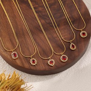 TN909a Dây chuyền titan mặt hình ovan đinh đá đỏ