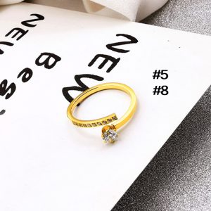 TC157 Nhẫn titan hở chéo nhau đính đá màu vàng
